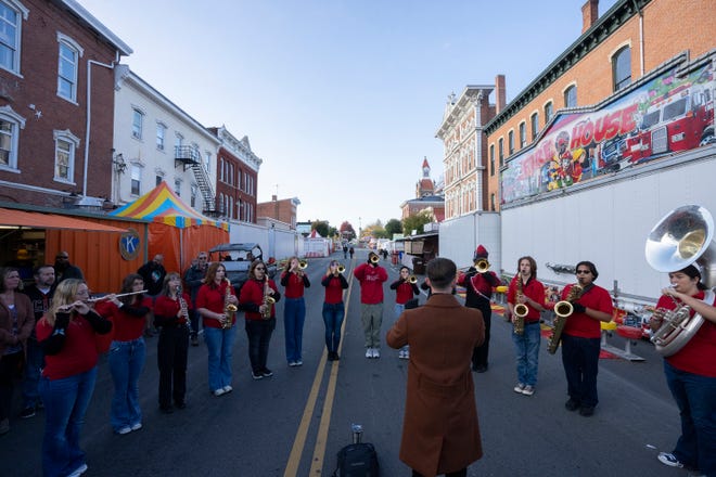 Oct 18, 2023; Circleville, OH, USA; Members of the Circleville High School Marching Band perform the Natinal Anthem at the start of the Circleville Pumpkin Show.