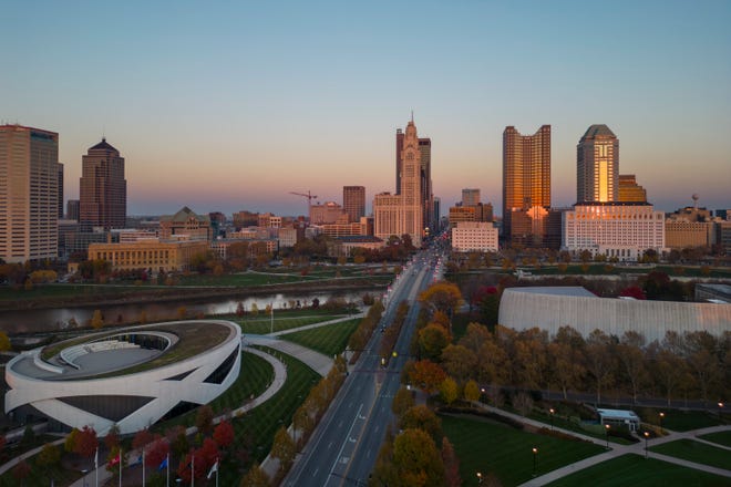 Nov 8, 2023; Columbus, Ohio, USA; The setting sun illuminates the downtown Columbus skyline during the last few minutes of daylight shortly after 5pm. The end of Daylight Saving Time has brought sunsets an hour earlier this week.