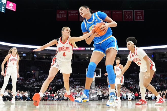 Dec 18, 2023; Columbus, OH, USA; UCLA Bruins center Lauren Betts (51) grabs a rebound away from Ohio State Buckeyes guard Jacy Sheldon (4) during the second half of the NCAA women’s basketball game at Value City Arena. Ohio State lost 77-71.