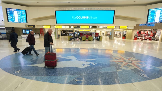 Travelers move through the John Glenn International Airport in Columbus. Construction could start as early as next year on a proposed new $2-billion terminal at John Glenn Columbus International Airport, designed to provide a more efficient, more modern and more comfortable experience for travelers.