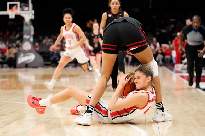 Jan 11, 2024; Columbus, Ohio, USA; Ohio State Buckeyes guard Jacy Sheldon (4) steals the ball from Rutgers Scarlet Knights guard Antonia Bates (4) during the first half of the NCAA women’s basketball game at Value City Arena.