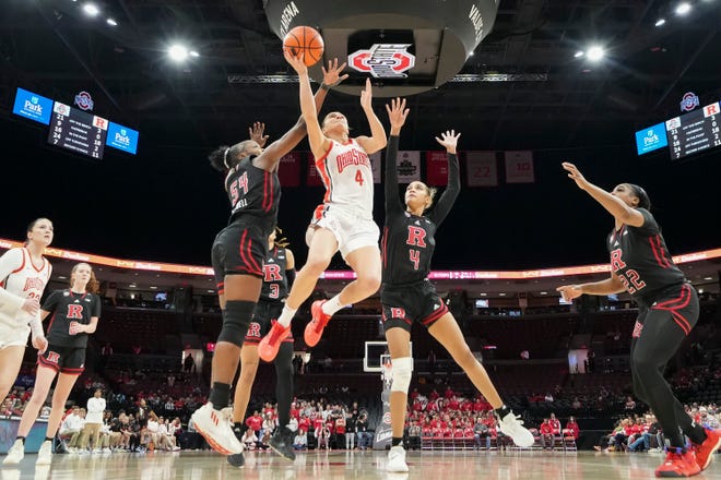Jan 11, 2024; Columbus, Ohio, USA; Ohio State Buckeyes guard Jacy Sheldon (4) makes a layup between Rutgers Scarlet Knights center Chyna Cornwell (54) and guard Antonia Bates (4) during the second half of the NCAA women’s basketball game at Value City Arena. Ohio State won 90-55.