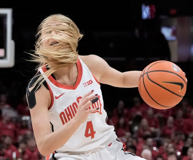 Jan. 14, 2024; Columbus, Ohio, USA; 
Ohio State Buckeyes guard Jacy Sheldon (4) gets hair in her face while driving down the court during the third quarter of an NCAA Division I basketball game against the Michigan State Spartans on Sunday at Value City Arena in Columbus.
