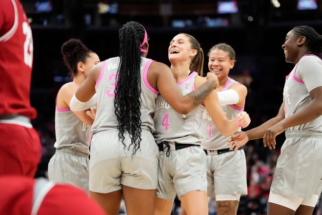 Feb 1, 2024; Columbus, OH, USA; Teammates celebrate a shot and drawn foul by Ohio State Buckeyes guard Jacy Sheldon (4) during the second half of the NCAA women’s basketball game against the Wisconsin Badgers at Value City Arena. Ohio State won 87-49.