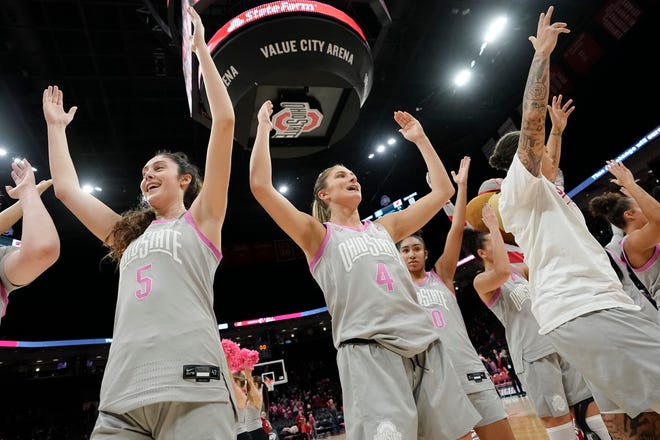 Feb 1, 2024; Columbus, OH, USA; Ohio State Buckeyes guard Emma Shumate (5) and guard Jacy Sheldon (4) sing “Carmen Ohio” following their 87-49 win over the Wisconsin Badgers in the NCAA women’s basketball game at Value City Arena.