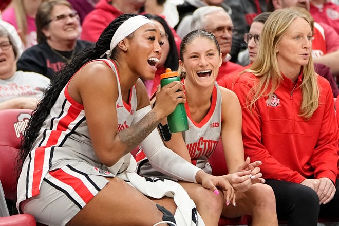 Feb 14, 2024; Columbus, Ohio, USA; Ohio State Buckeyes forward Cotie McMahon (32) and guard Jacy Sheldon (4) sing along to a Taylor Swift song on the bench during the second half of the NCAA women’s basketball game against the Nebraska Cornhuskers at Value City Arena. Ohio State won 80-47.