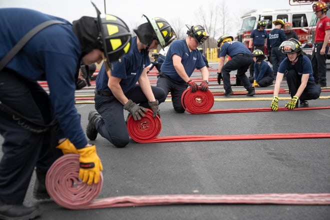 Feb 27, 2024; Reynoldsburg, OH, United States; Students traini in a technique on how to roll a firehose when gathering it after use during a training session at the Division of State Fire MarshalÕs Ohio Fire Academy.