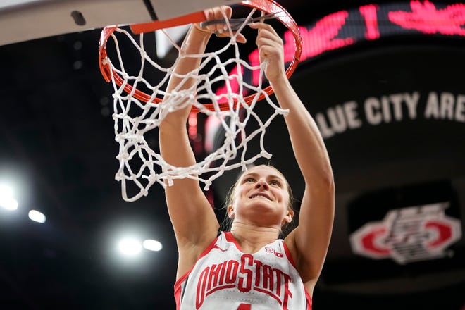 Feb 28, 2024; Columbus, OH, USA; Ohio State Buckeyes guard Jacy Sheldon (4) cuts down the net as the team celebrates winning the Big Ten regular season title after the 67-51 win over the Michigan Wolverines in the NCAA women’s basketball game at Value City Arena.