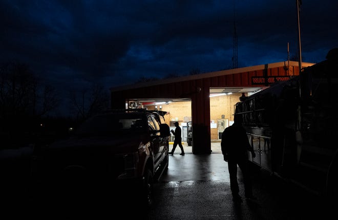 Mar 5, 2024; Greenfield, OH, United States; Volunteer firefighter Chris Braman walks toward a pickup truck at the Wayne Township Fire Department in Good Hope, Ohio. Volunteers gather once a month to inventory the equipment and make sure itÕs working correctly.