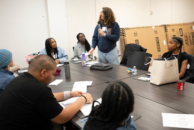 Students, including Araceli Shingler, center, and instructors participate in the Columbus Journalists in Training class.