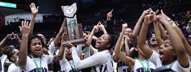 Africentric players celebrate after beating Ottawa-Glandorf in the OHSAA Division III state championship Saturday, March 16, 2024.