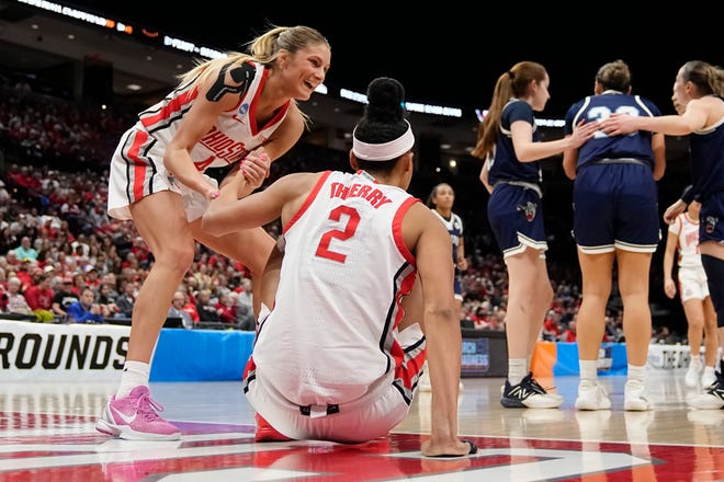 Mar 22, 2024; Columbus, OH, USA; Ohio State Buckeyes guard Jacy Sheldon (4) helps up guard Taylor Thierry (2) after she was fouled during the first half of the women’s basketball NCAA Tournament first round game against the Maine Black Bears at Value City Arena.