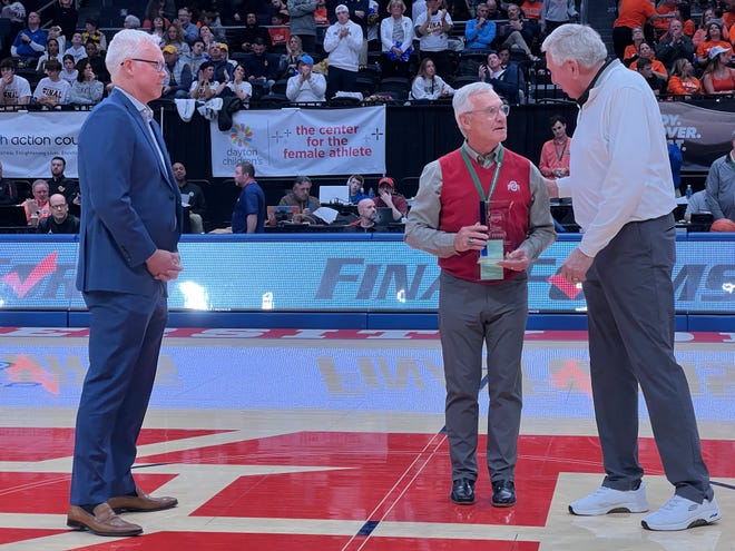Former Ohio State football coach Jim Tressel was honored Saturday as part of the OHSAA's Circle of Champions program. Also pictured are former Ohio State quarterback Bob Hoying and former Ohio State basketball player Bill Hosket.