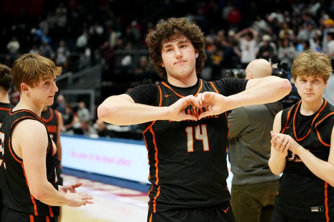 Mar 23, 2024; Dayton, Ohio, USA; Delaware Hayes' Jake Lowman (14) makes the sign of a heart to the fans after losing 54-53 to Cleveland St. Ignatius during the Division I state semifinal at University of Dayton Arena.