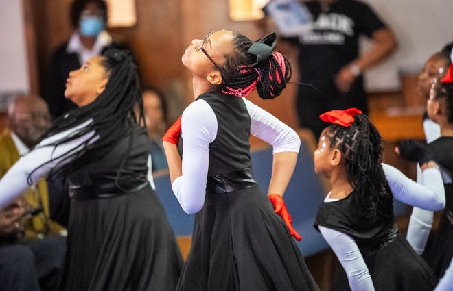 Mar 24, 2024; Columbus, OH; TaÕNare Williams dances with the Butterflies and OSAO (Our Steps Are Ordered) Dance Ministry during an Easter performance at the Family Missionary Baptist Church on Palm Sunday.