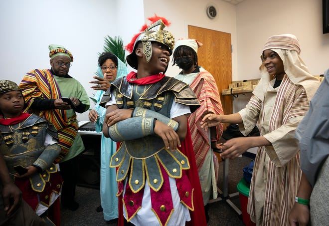 Mar 24, 2024; Columbus, OH; Sincere Ingram, dressed as a soldier, laughs with other performers before an Easter performance at the Family Missionary Baptist Church on Palm Sunday.