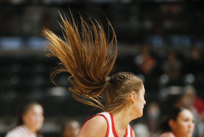 Ohio State Buckeyes guard Jacy Sheldon (4) turns and her ponytail flies up during the NCAA women’s basketball game between Ohio State University at the University of Cincinnati in Columbus, Ohio, on Saturday, Nov. 27, 2021.