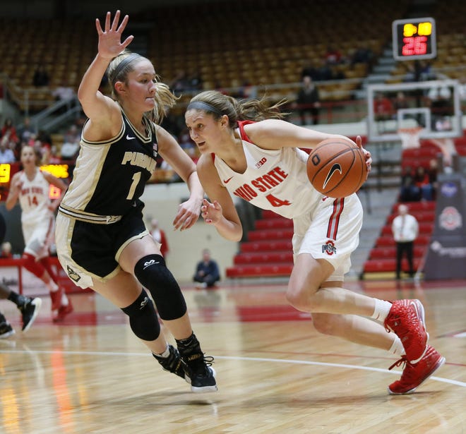 Ohio State Buckeyes guard Jacy Sheldon (4) drives to the basket passed Purdue Boilermakers guard Karissa McLaughlin (1) during the first half of the game between the Ohio State Buckeyes and the Purdue Boilermakers at St. John Arena in Columbus, Ohio Saturday, Dec. 28, 2019. [Maddie Schroeder/Dispatch]