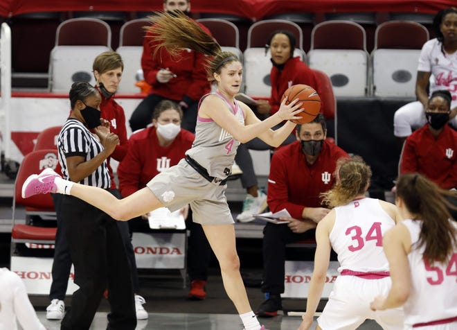 Ohio State Buckeyes guard Jacy Sheldon (4) saves the ball from going out against Indiana Hoosiers during the second quarter of their game at Value City Arena in Columbus, Ohio on February 27, 2021.