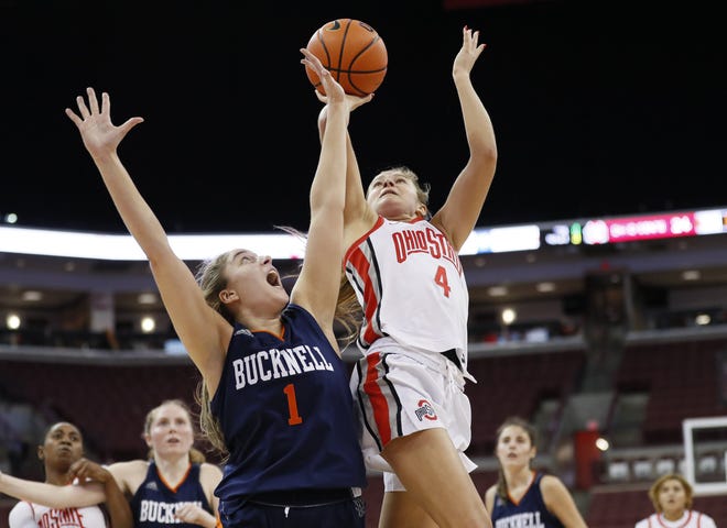 Ohio State Buckeyes guard Jacy Sheldon (4) shoots over Bucknell Bison forward Remi Sisselman (1) during the second quarter of the NCAA women's basketball game at Value City Arena in Columbus on Wednesday, Nov. 10, 2021.