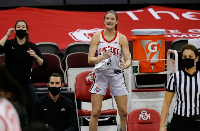 Ohio State Buckeyes guard Jacy Sheldon (4) celebrates from the bench late in the fourth quarter of the NCAA women's college basketball game against the Purdue Boilermakers at Value City Arena in Columbus on Thursday, Feb. 18, 2021. Ohio State won 100-85.