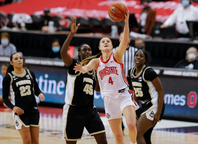 Ohio State Buckeyes guard Jacy Sheldon (4) drives to the basket ahead of Purdue Boilermakers center Fatou Diagne (45) and guard Tamara Farquhar (25) during the first quarter of the NCAA women's college basketball game at Value City Arena in Columbus on Thursday, Feb. 18, 2021.