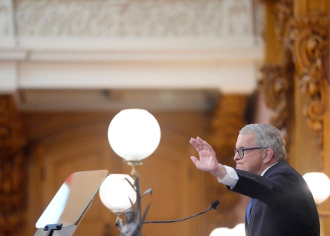 April 10, 2024; Columbus, Ohio, USA; 
Ohio Governor Mike DeWine waves at the completion of his 2024 State of the State address in the Ohio House chambers at the Ohio Statehouse on Wednesday afternoon.