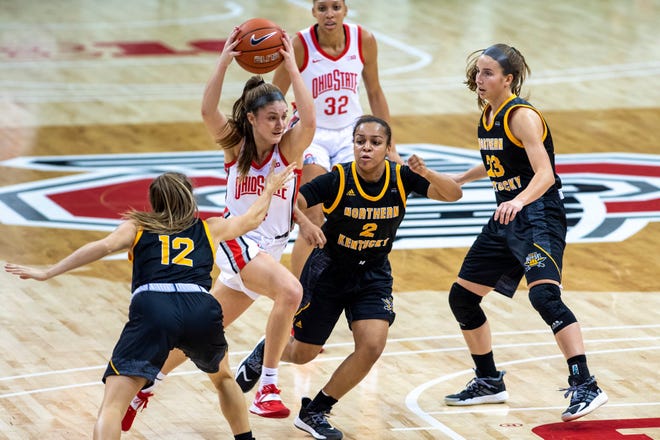 Ohio State Buckeyes guard Jacy Sheldon (4) breaks through several NKY defenders during the first half of Sunday's game between the Ohio State Buckeyes and the Northern Kentucky Norse at Value City Arena in Columbus, Ohio, on Dec. 06, 2020.