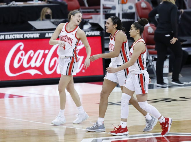 Ohio State Buckeyes guard Madison Greene (0), guard Braxtin Miller (10) and guard Jacy Sheldon (4) walk off the court following their 88-86 win over the Maryland Terrapins in the NCAA women's basketball game at Value City Arena in Columbus on Monday, Jan. 25, 2021.