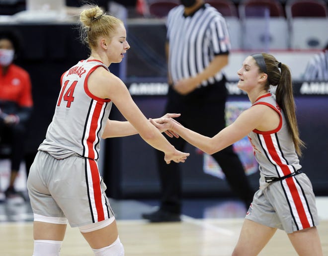 Ohio State Buckeyes forward Dorka Juhasz (14) celebrates after a basket with guard Jacy Sheldon (4) against Iowa Hawkeyes during the fourth quarter of their Big Ten game at Value City Arena in Columbus, Ohio on February 4, 2020.