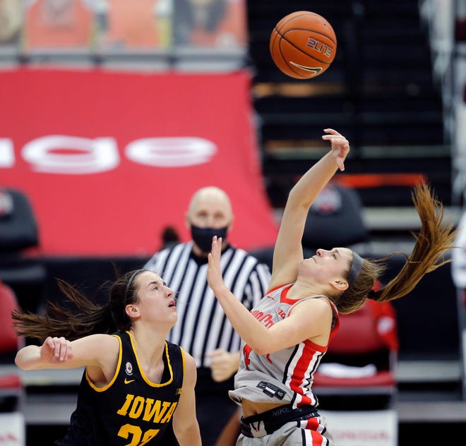 Ohio State Buckeyes guard Jacy Sheldon (4) gets fouled by Iowa Hawkeyes guard Caitlin Clark (22) during the fourth quarter of their Big Ten game at Value City Arena in Columbus, Ohio on February 4, 2020.