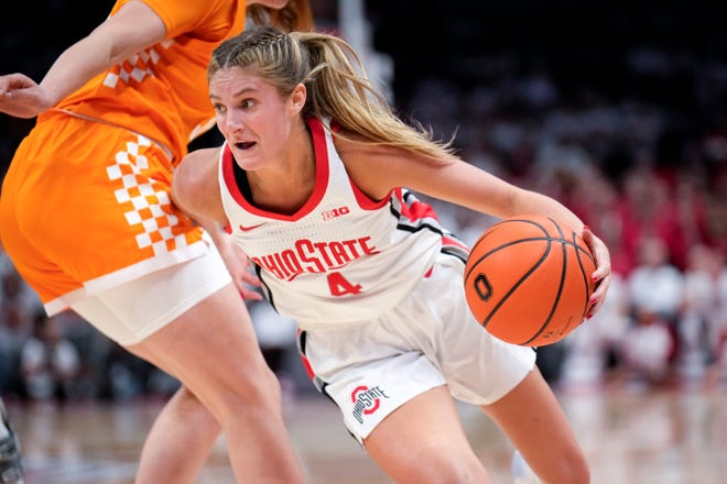 Nov 8, 2022; Columbus, OH, USA;  Ohio State Buckeyes guard Jacy Sheldon (4) drives past Tennessee Lady Volunteers forward Marta Suarez (33) during the second half of the NCAA Division I women’s basketball game at Value City Arena. Mandatory Credit: Joseph Scheller-The Columbus Dispatch