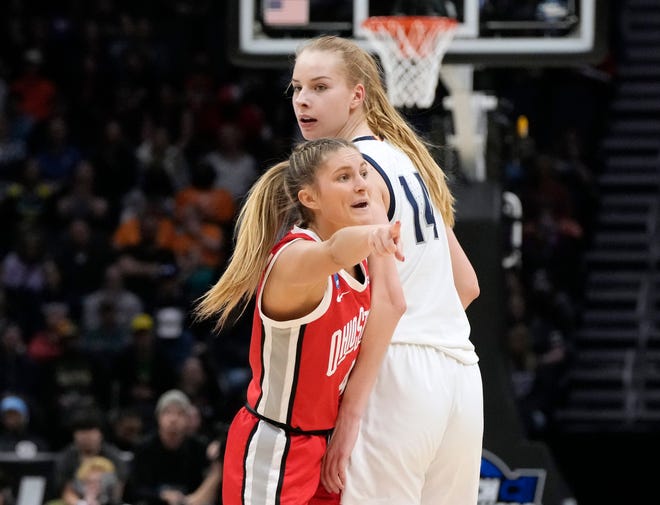 March 25, 2023; Seattle, WA, USA; Ohio State Buckeyes guard Jacy Sheldon (4) leans into UConn Huskies forward Dorka Juhasz (14) during the second half of an NCAA Tournament Sweet Sixteen game at Climate Pledge Arena in Seattle on Saturday. Ohio State won the game 73-61.
Mandatory Credit: Barbara J. Perenic/Columbus Dispatch